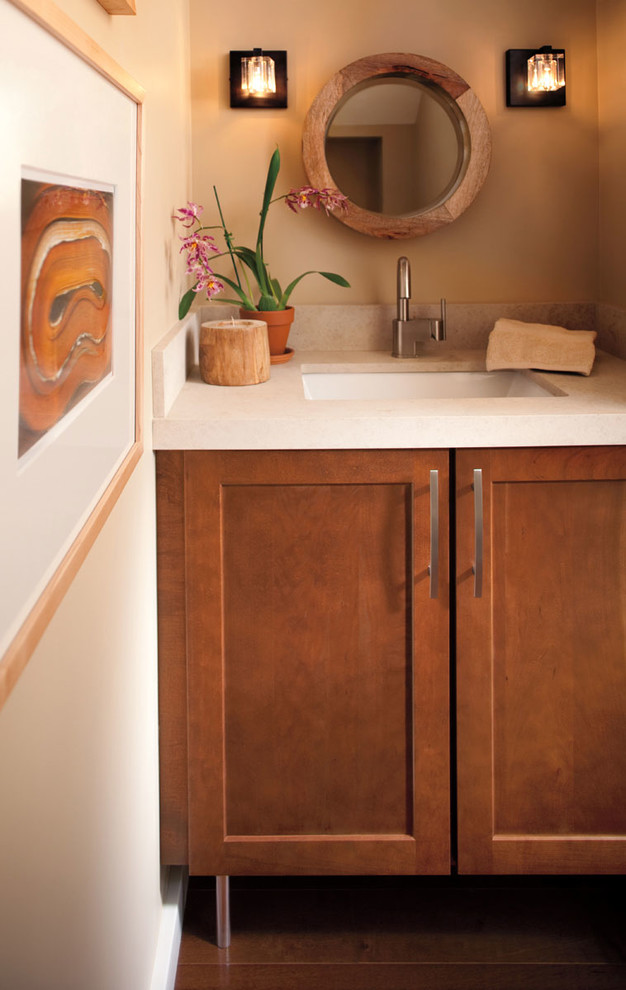 Réalisation d'un petit WC et toilettes tradition en bois brun avec un placard avec porte à panneau encastré, un mur beige, un sol en bois brun, un lavabo encastré, un plan de toilette en quartz modifié et un sol marron.