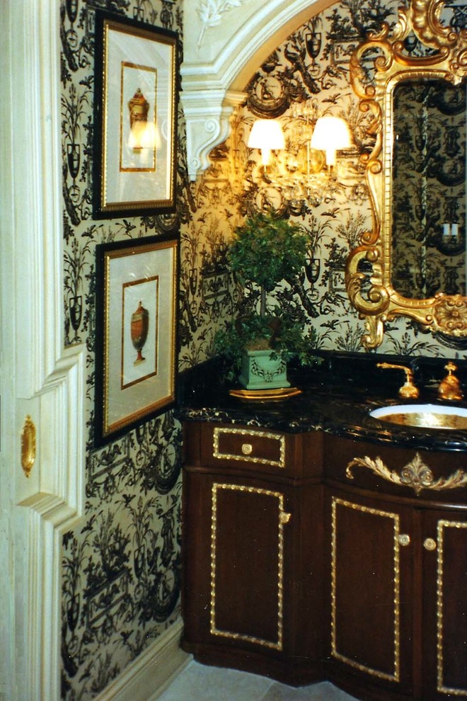 Inspiration for a large traditional cloakroom in Boston with freestanding cabinets, medium wood cabinets, limestone flooring, a submerged sink, marble worktops and beige floors.