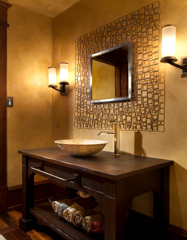 Photo of a rustic cloakroom in Other with a vessel sink.