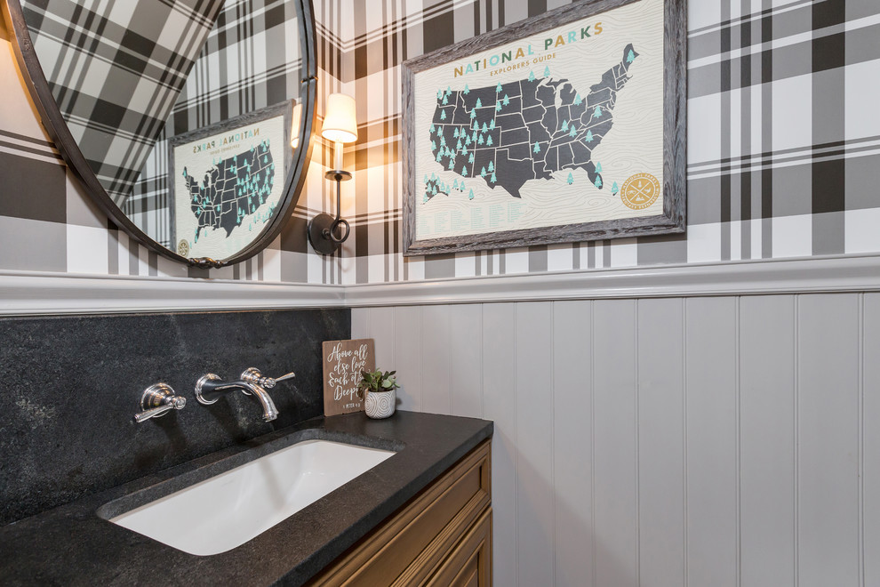 Design ideas for a country cloakroom in Philadelphia with medium wood cabinets, a submerged sink, black worktops, recessed-panel cabinets and multi-coloured walls.