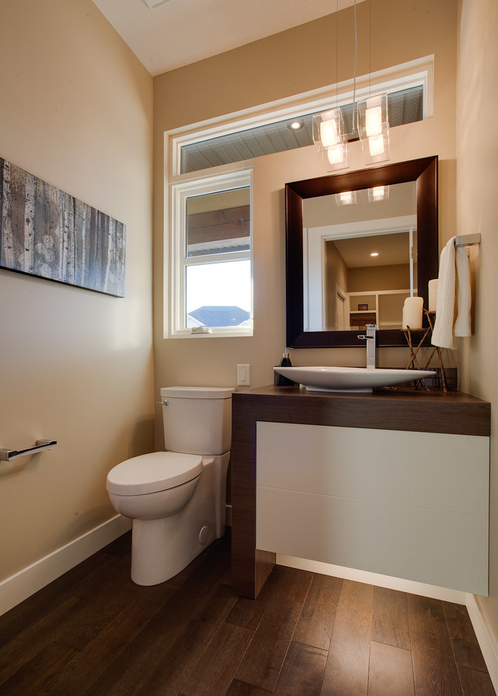 Example of a trendy powder room design in Vancouver with a vessel sink