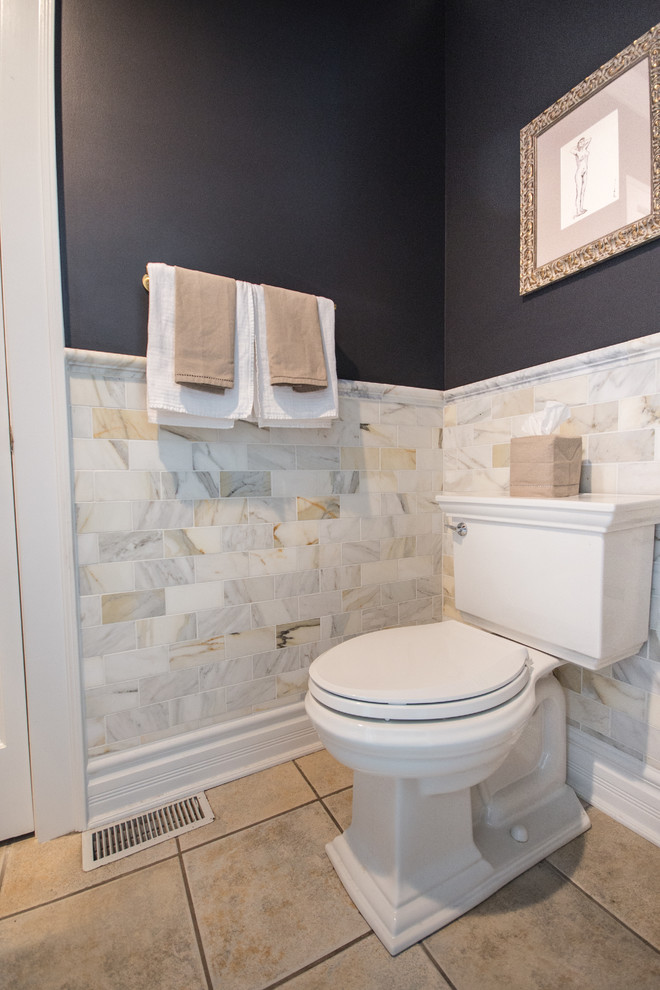 Medium sized classic cloakroom in Chicago with a two-piece toilet, multi-coloured tiles, marble tiles, grey walls, ceramic flooring, a vessel sink, solid surface worktops and brown floors.
