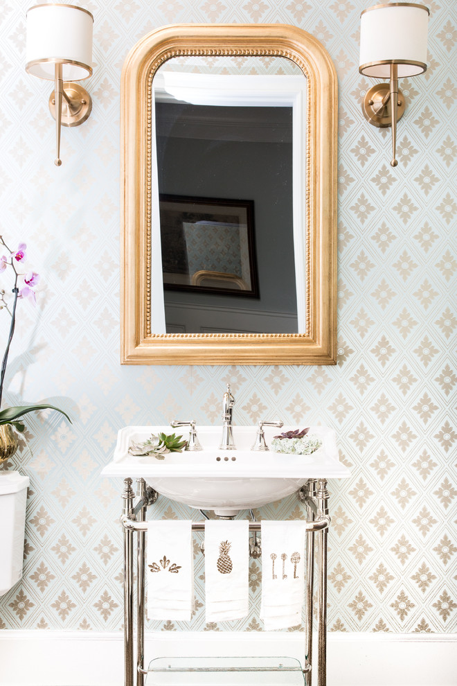 Example of a mid-sized transitional powder room design in Chicago with a console sink