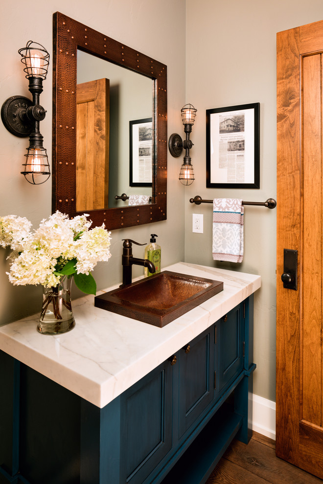 Example of a cottage powder room design in Chicago with furniture-like cabinets, blue cabinets, beige walls and a drop-in sink