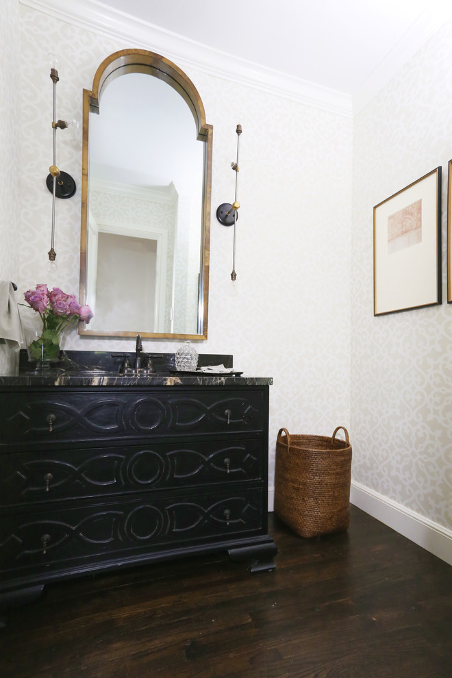 This is an example of a classic cloakroom in Other with freestanding cabinets, black cabinets, granite worktops, brown floors and black worktops.