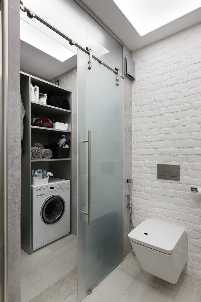 Inspiration för industriella små tvättstugor, med grå väggar