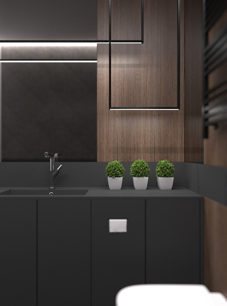Exempel på en mellanstor modern svarta linjär svart tvättstuga enbart för tvätt och med garderob, med en integrerad diskho, släta luckor, svarta skåp, bänkskiva i koppar, svarta väggar, klinkergolv i keramik och grått golv