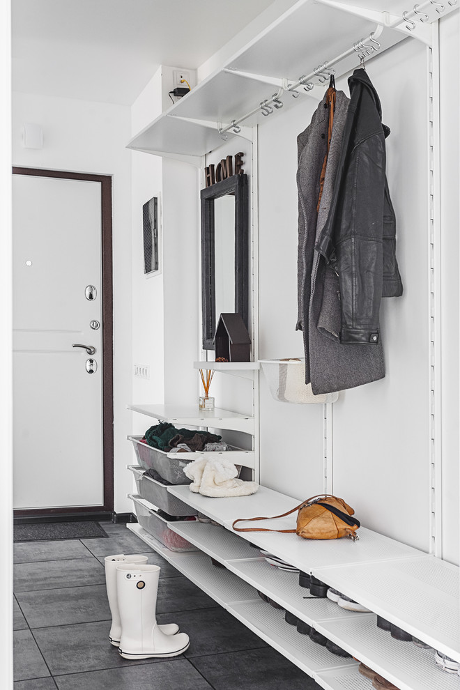 Danish gray floor entryway photo in Moscow with white walls and a white front door