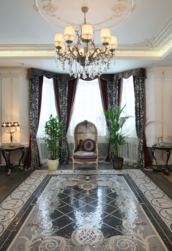 Large traditional entrance in Moscow with white walls, marble flooring and white floors.