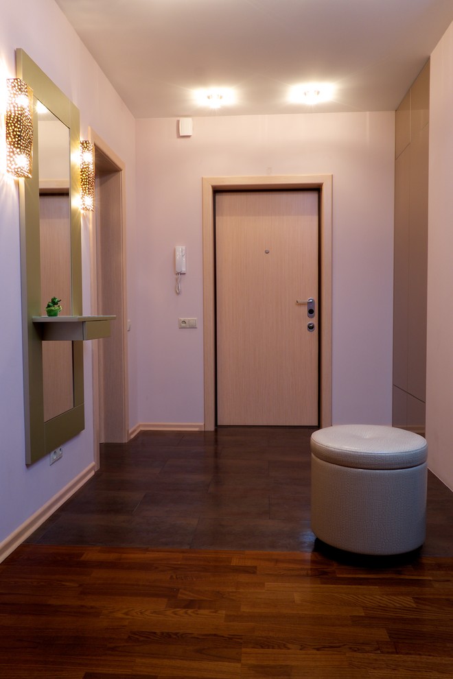 This is an example of a small contemporary front door in Other with pink walls, ceramic flooring, a single front door, a light wood front door and purple floors.