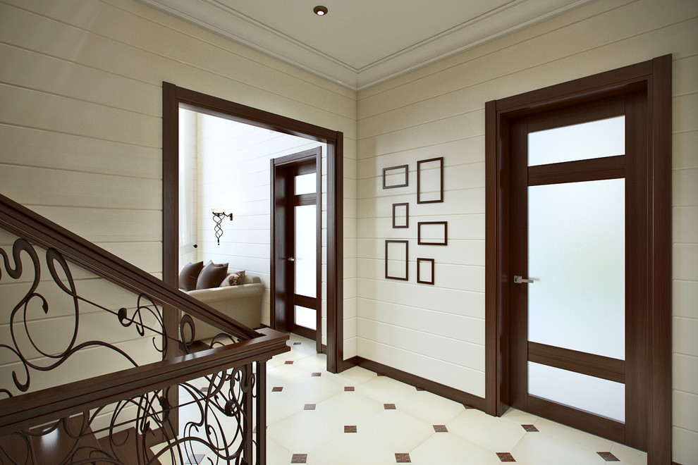 Modelo de vestíbulo de estilo de casa de campo de tamaño medio con paredes blancas, suelo de baldosas de porcelana, puerta simple, puerta marrón y suelo beige