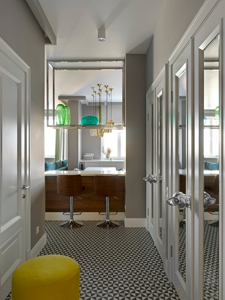 Inspiration for a transitional multicolored floor entryway remodel in Moscow with gray walls