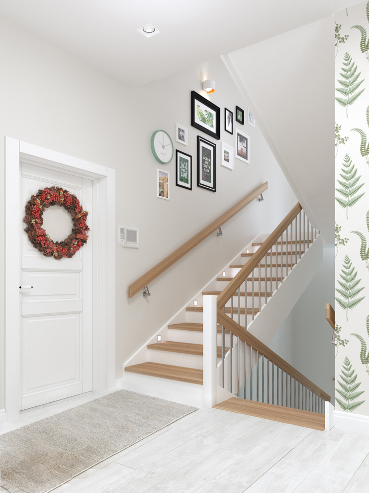 他の地域にある低価格の中くらいな北欧スタイルのおしゃれな玄関ロビー (白い壁、ラミネートの床、白いドア、白い床) の写真
