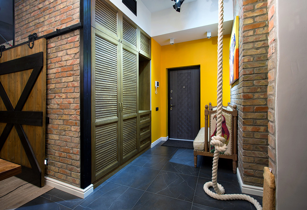 Entryway - industrial entryway idea in Other with multicolored walls and a black front door