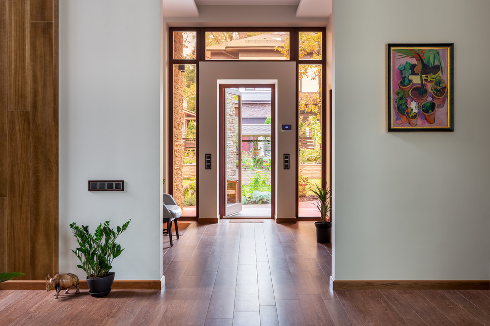 This is an example of a medium sized scandi foyer in Moscow with terracotta flooring and a single front door.