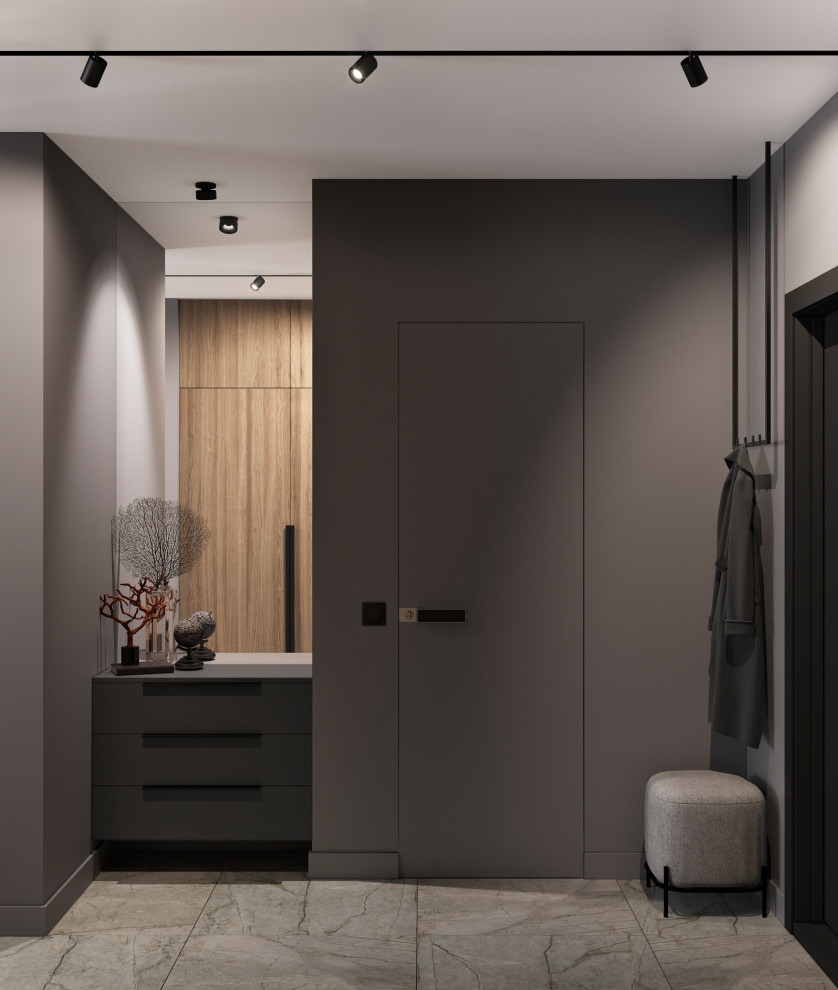 Inspiration pour une petite entrée design avec un couloir, un mur gris, un sol en carrelage de porcelaine, une porte simple, une porte noire et un sol gris.