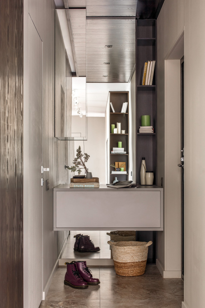 Inspiration for a mid-sized contemporary brown floor entryway remodel in Other