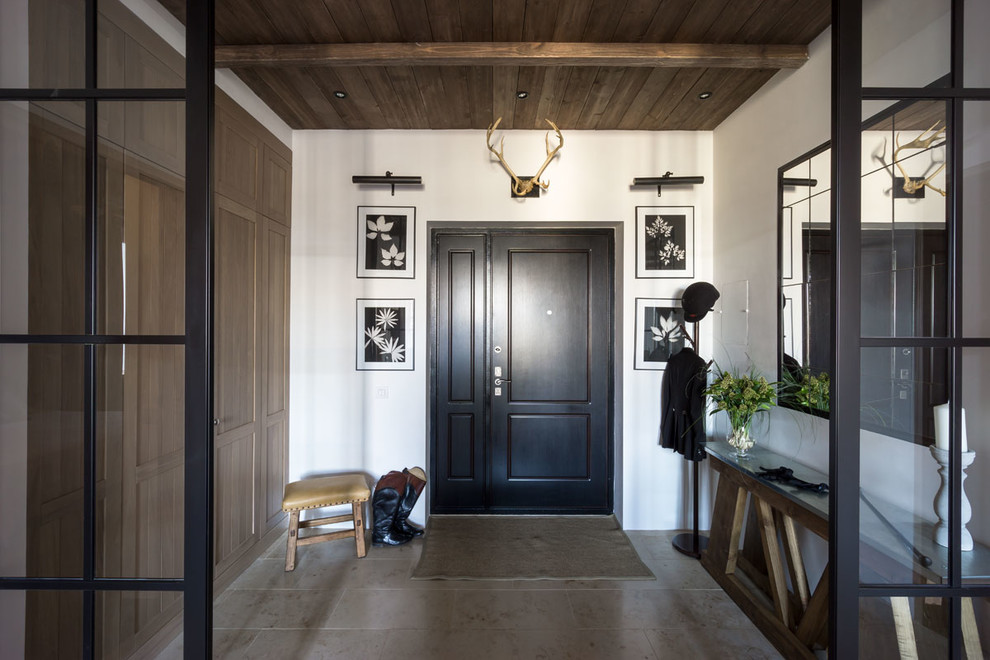 Свежая идея для дизайна: входная дверь в стиле неоклассика (современная классика) с белыми стенами, двустворчатой входной дверью и черной входной дверью - отличное фото интерьера