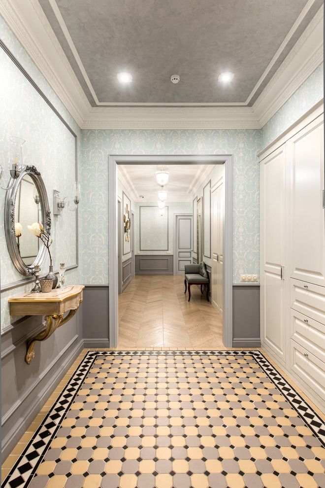 Medium sized traditional entrance in Moscow with blue walls, ceramic flooring and multi-coloured floors.