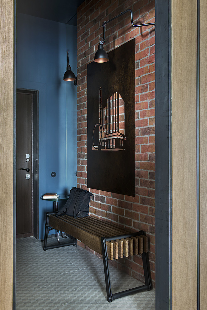 Example of an urban porcelain tile and gray floor entryway design in Moscow with blue walls