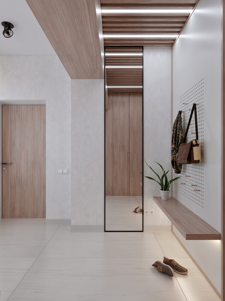 Idee per un ingresso con vestibolo minimal di medie dimensioni con pavimento in gres porcellanato, pareti grigie, una porta in legno bruno e pavimento grigio