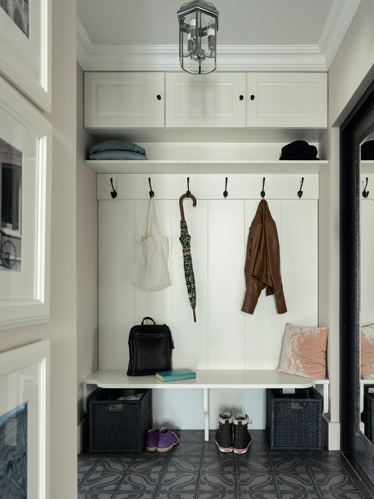 Example of a classic gray floor entryway design in Moscow with white walls