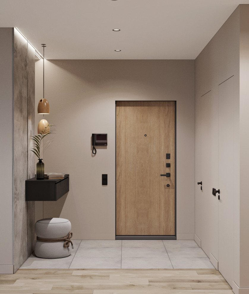Esempio di una porta d'ingresso nordica di medie dimensioni con pareti beige, pavimento in gres porcellanato, una porta singola, una porta in legno bruno e pavimento grigio