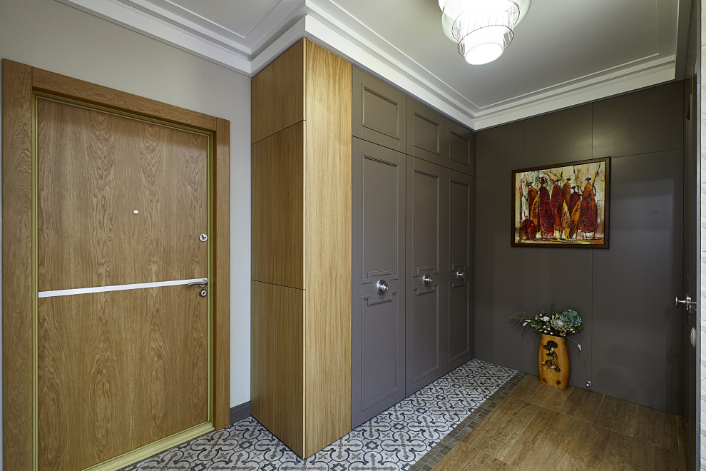 Example of a trendy entryway design in Moscow with gray walls