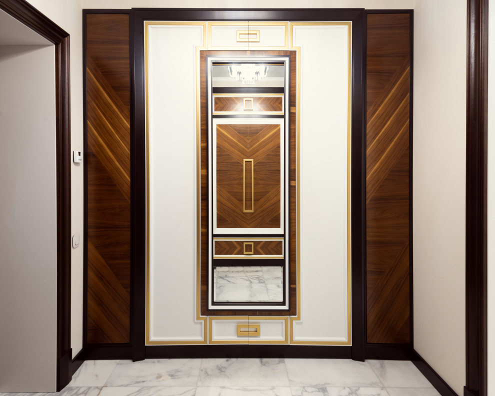 Inspiration pour un vestibule design de taille moyenne avec un mur beige, un sol en marbre, une porte simple, une porte en bois foncé et un sol blanc.