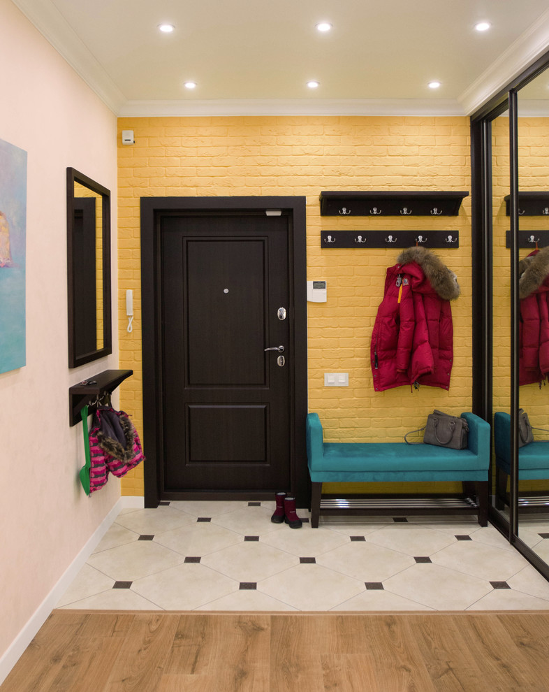 Entryway - eclectic white floor entryway idea in Novosibirsk with yellow walls and a black front door