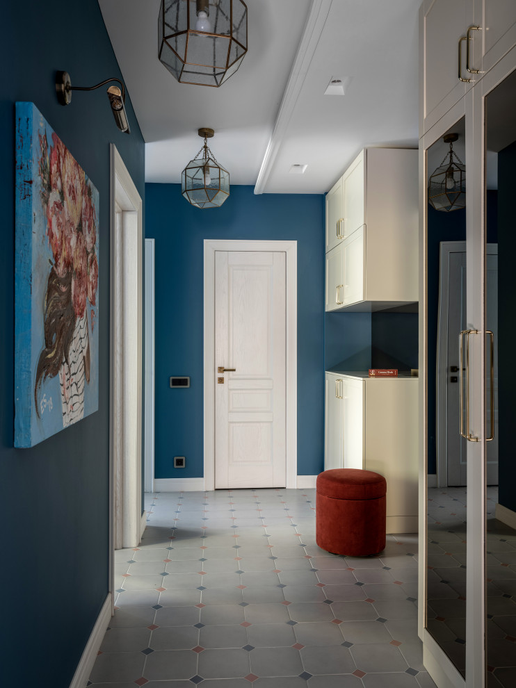 This is an example of a small contemporary hallway in Toronto with blue walls, ceramic flooring, multi-coloured floors, a single front door and a white front door.