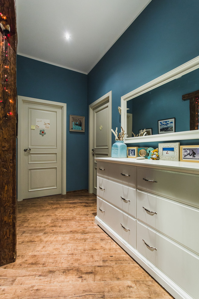 Inspiration for a contemporary medium tone wood floor entryway remodel in Moscow with blue walls