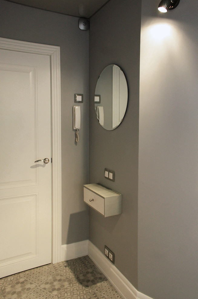 Small contemporary front door in Moscow with grey walls, ceramic flooring, a single front door and a white front door.