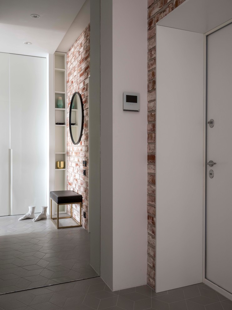 Trendy gray floor entryway photo in Moscow with white walls and a white front door