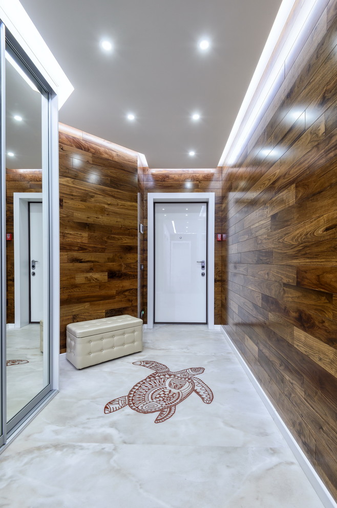 Idée de décoration pour une entrée design avec une porte simple, une porte blanche et un couloir.