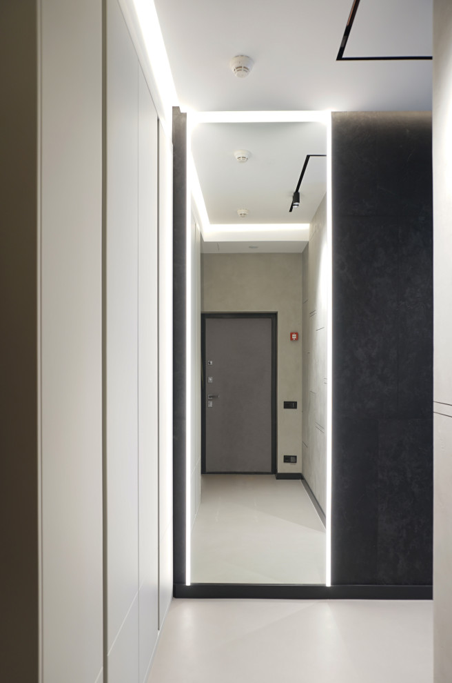 Inspiration pour une petite porte d'entrée design avec un mur gris, sol en béton ciré, une porte simple, une porte grise, un sol gris et un plafond décaissé.
