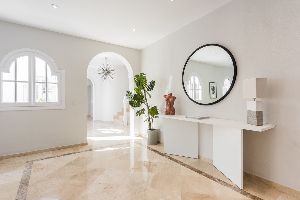 Hallway - contemporary beige floor hallway idea in Malaga with white walls