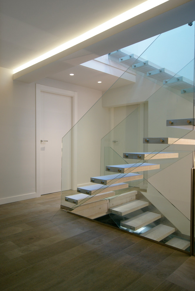 Staircase - large modern staircase idea in Other