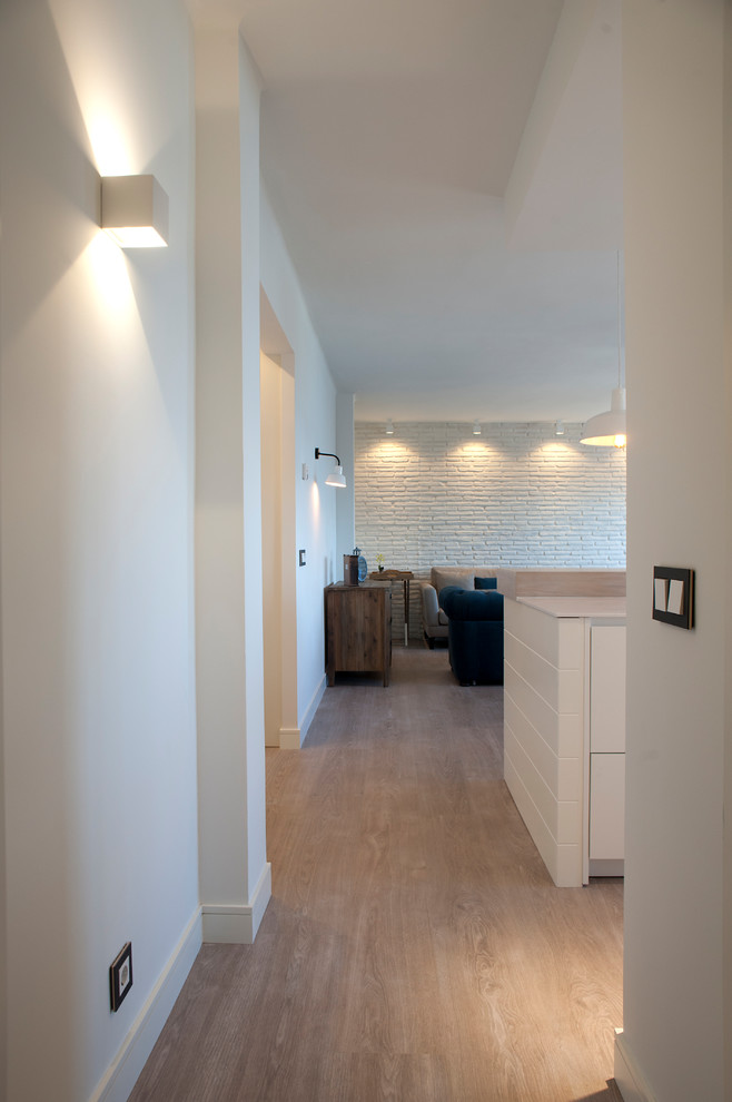 Example of a small beach style hallway design in Bilbao with white walls