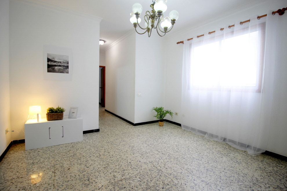 Large danish ceramic tile and multicolored floor hallway photo in Other with white walls