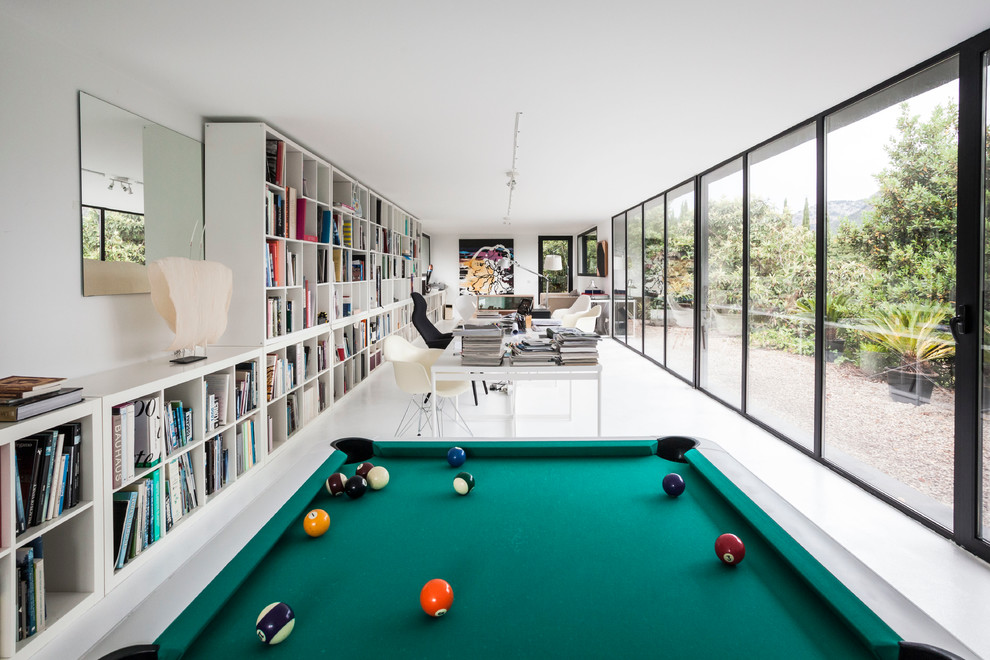 Photo of a large contemporary open plan games room in Palma de Mallorca with white walls and no tv.