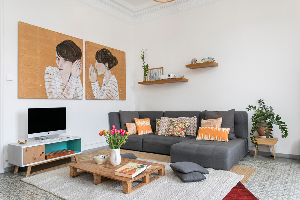 Inspiration for a mid-sized eclectic open concept family room remodel in Barcelona with white walls