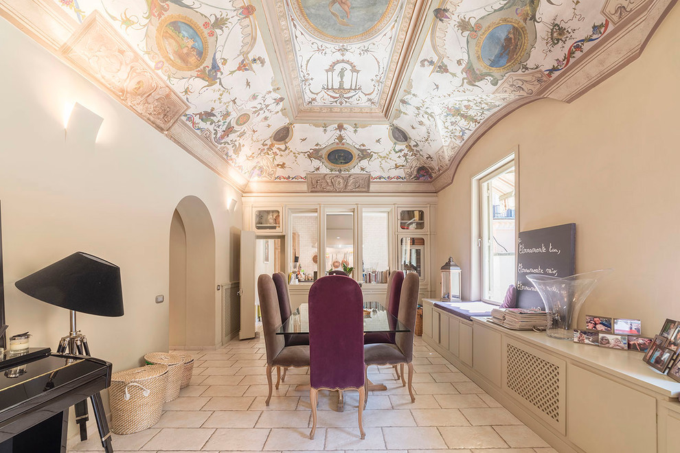 Example of a large classic limestone floor and beige floor enclosed dining room design in Rome with beige walls and no fireplace