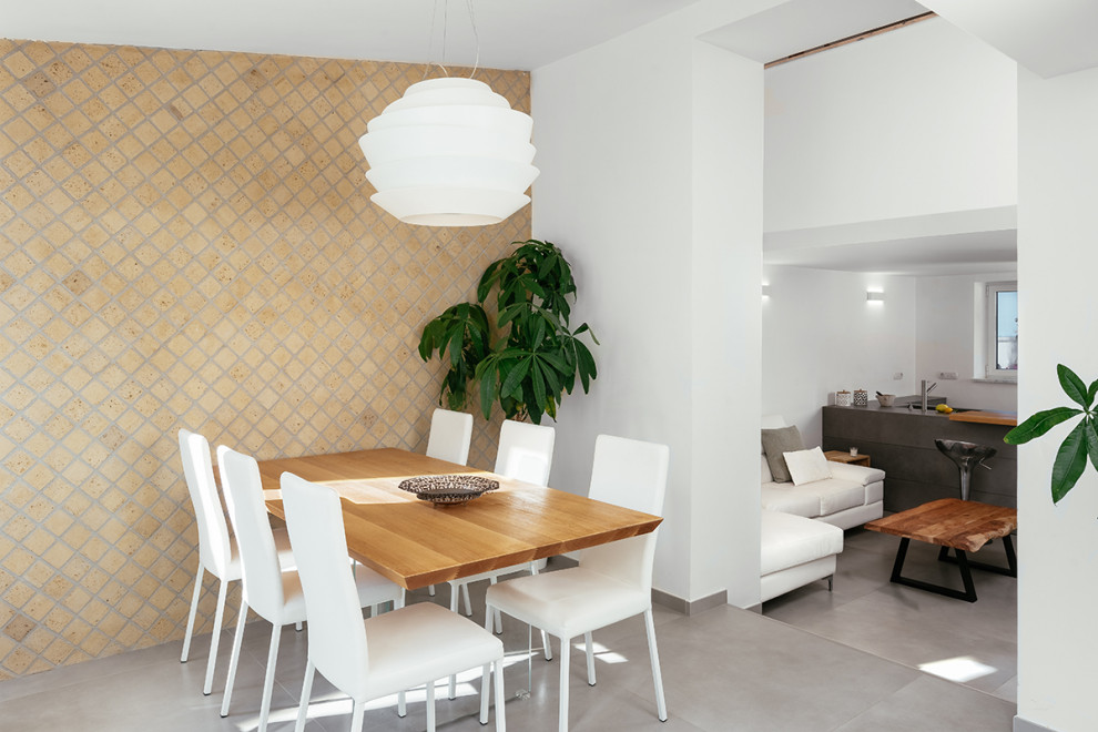 Inspiration for a contemporary kitchen/dining room in Naples with beige walls, porcelain flooring and grey floors.