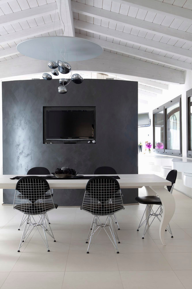 Exemple d'une salle à manger ouverte sur le salon tendance de taille moyenne avec un mur blanc.