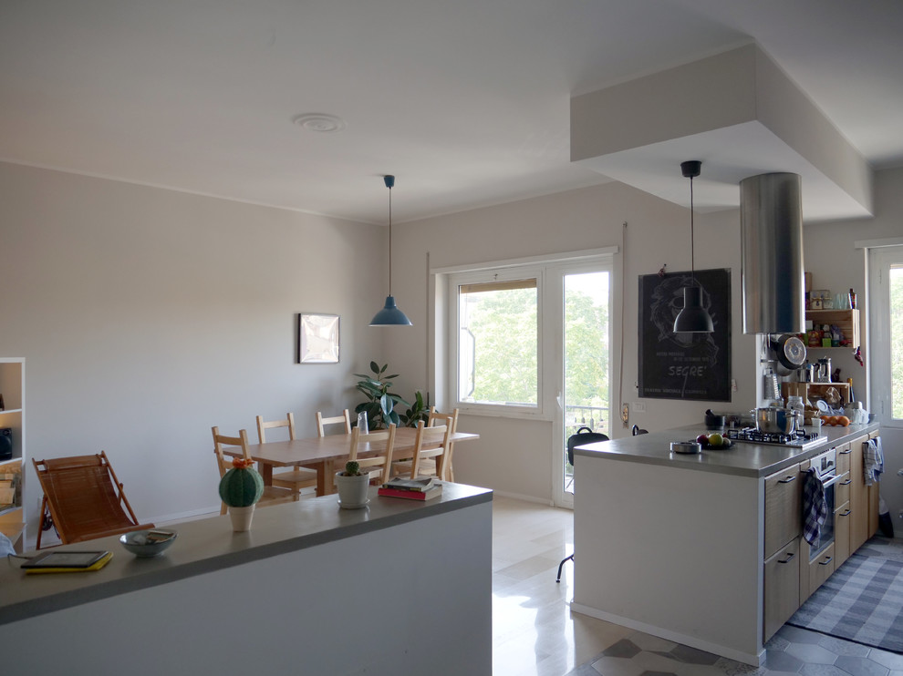 This is an example of a contemporary kitchen/dining room in Rome.