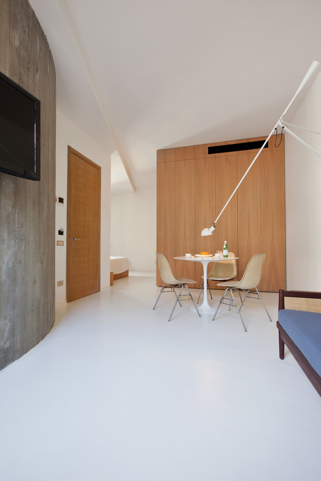 Ispirazione per una sala da pranzo aperta verso il soggiorno minimal di medie dimensioni con pareti bianche