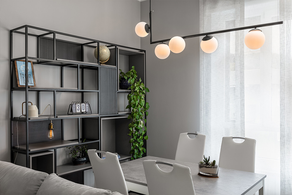 Esempio di una sala da pranzo aperta verso il soggiorno design di medie dimensioni con pareti bianche e pavimento in gres porcellanato
