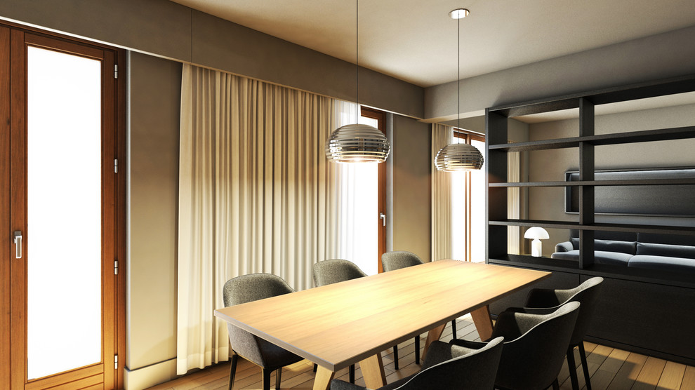 Immagine di una piccola sala da pranzo aperta verso il soggiorno minimal con pareti multicolore e pavimento in legno massello medio