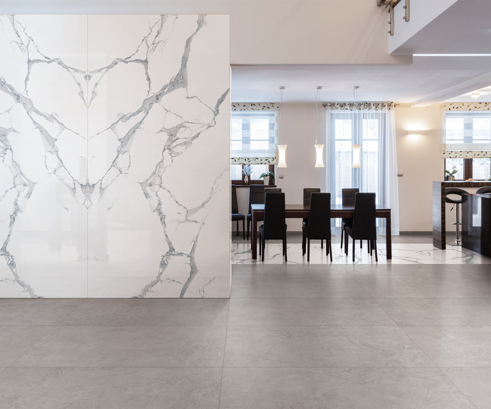 Cette photo montre une salle à manger moderne avec un mur blanc, un sol en carrelage de porcelaine et un sol gris.